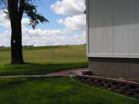 The back of the house and another flower garden.